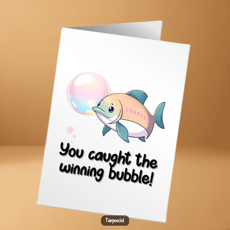 Funny Free Printable Congratulations Card: A tarpon enthusiastically chases a beautiful, shimmering iridescent bubble, symbolizing pursuit of goals.